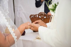 placing the ring on her finger